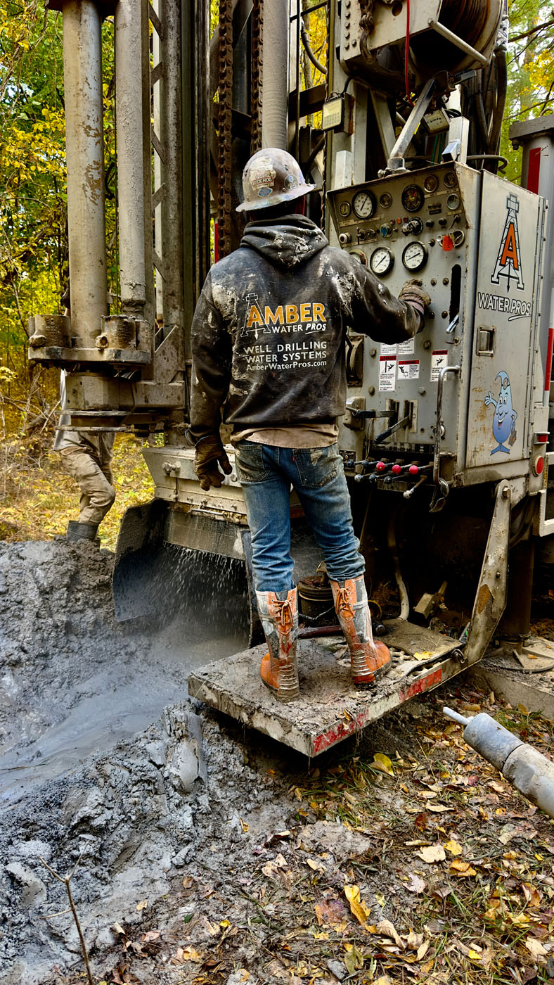 A drill at the beginning of an Amber Water Pros well installation.