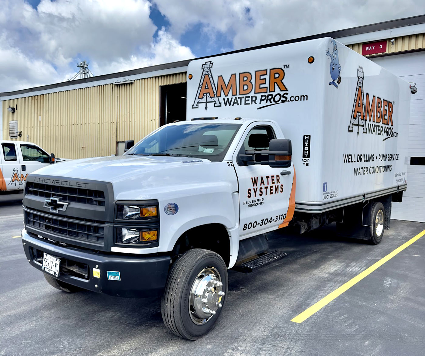 An Amber Water Pros truck at a warehouse. 
