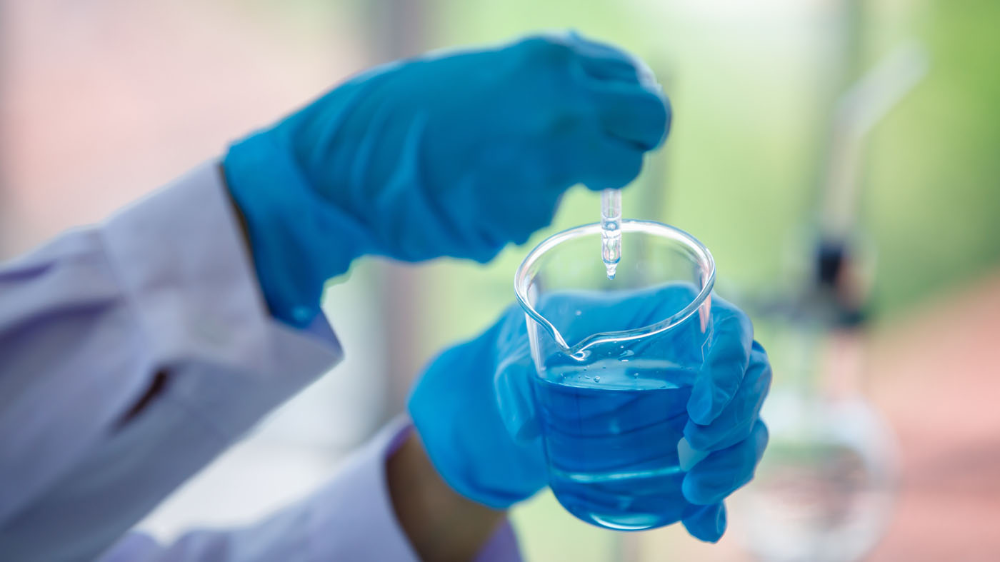 A scientist testing water quality, choose us for your Upstate NY & NE PA water treatment systems.